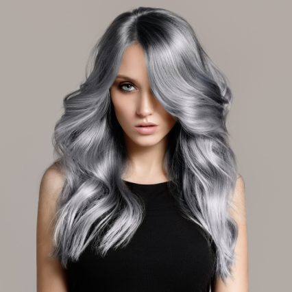 Beautiful,Woman,With,Long,Wavy,Coloring,Hair.,Flat,Gray,Background.